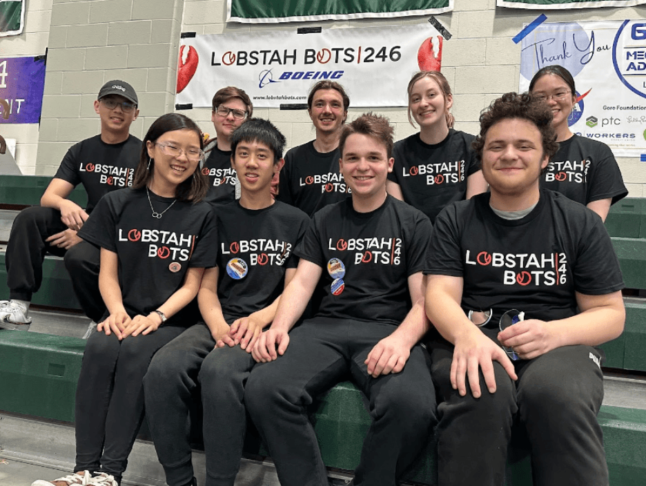 The Lobstah Bots posing by our banner at the Week 2 Rhode Island event.