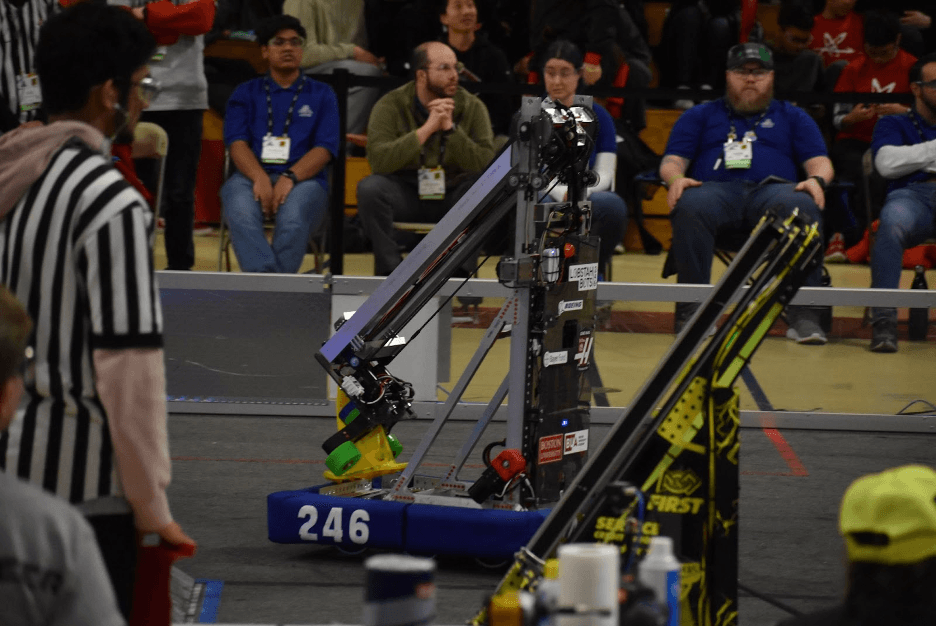 Our robot taking a cone across the field at the Week 4 Greater Boston event.