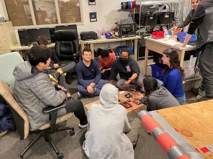 Sonya '24 and Kendree '25 leading the first electrical training around the electrical test bench.