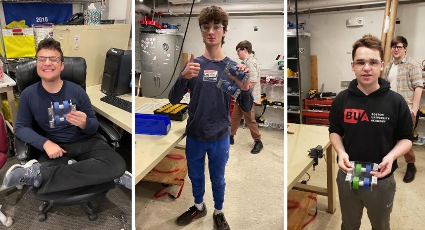 Eli '24, Owen '25, and George '24 showing off their finished mini drivetrain projects from this fall’s mechanical trainings.
