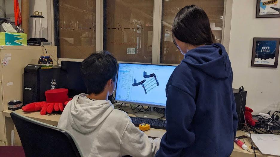 Teddy '27 and Sharon '27 working together on the CAD for our offseason robot’s intake.