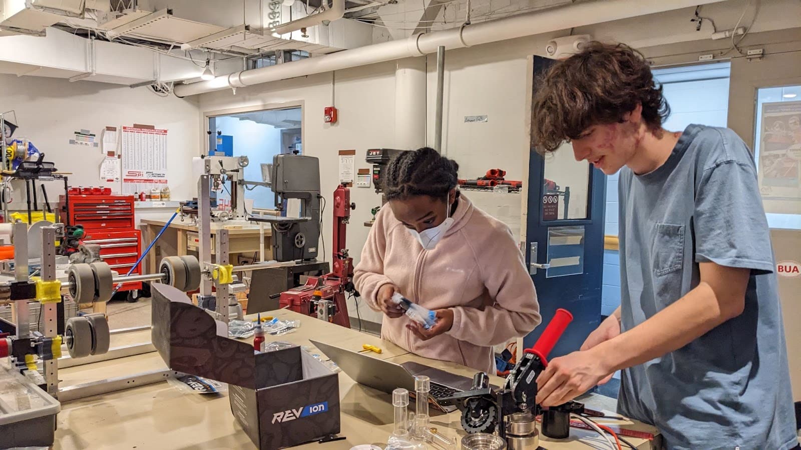 Makeda Daniel ‘27 and Alex Nowosielski ‘26 working together to build one of the robot’s swerve modules.