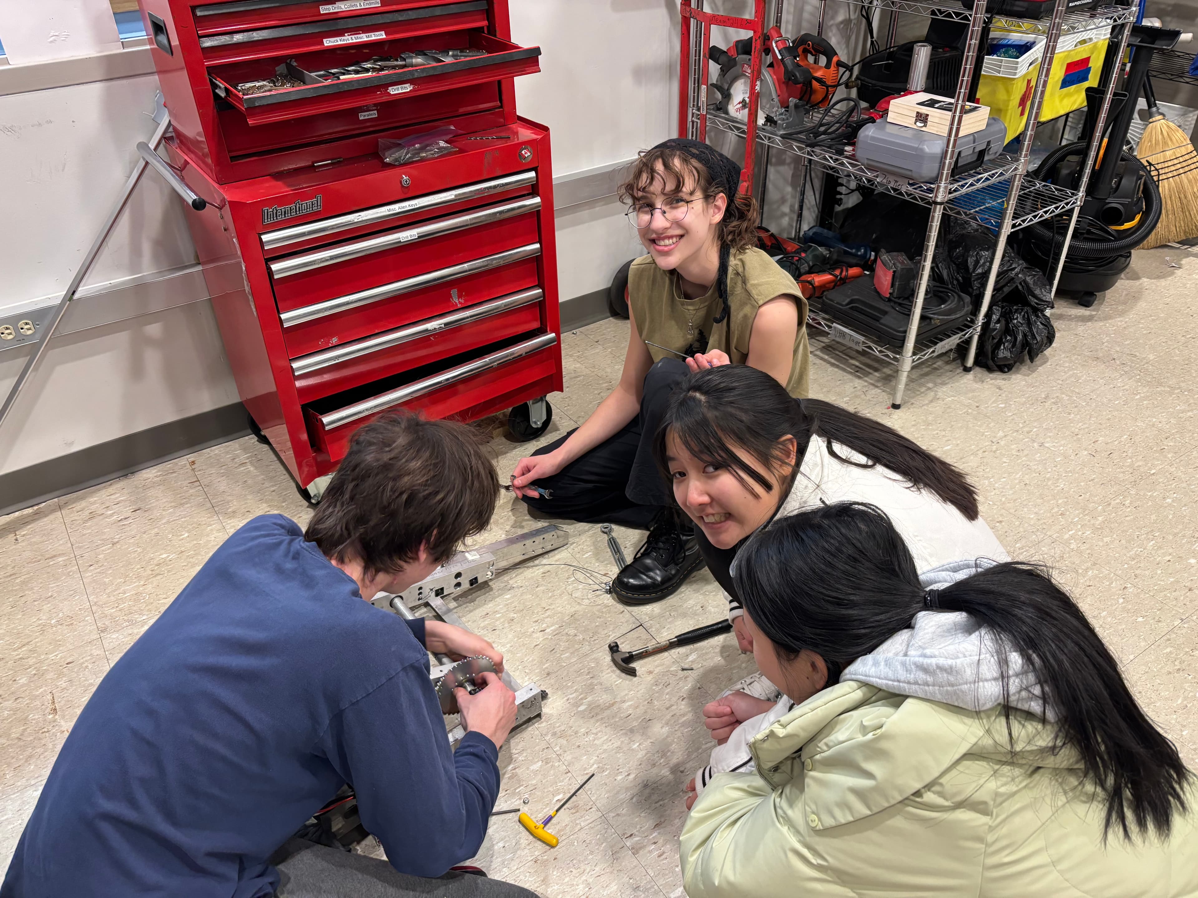 Alex Nowosielski ‘26, Arden Nasveschuk ‘26, Angel Dong ‘26, and Kelsey Liu ‘26 taking apart our beloved 2024 robot Woodpecker