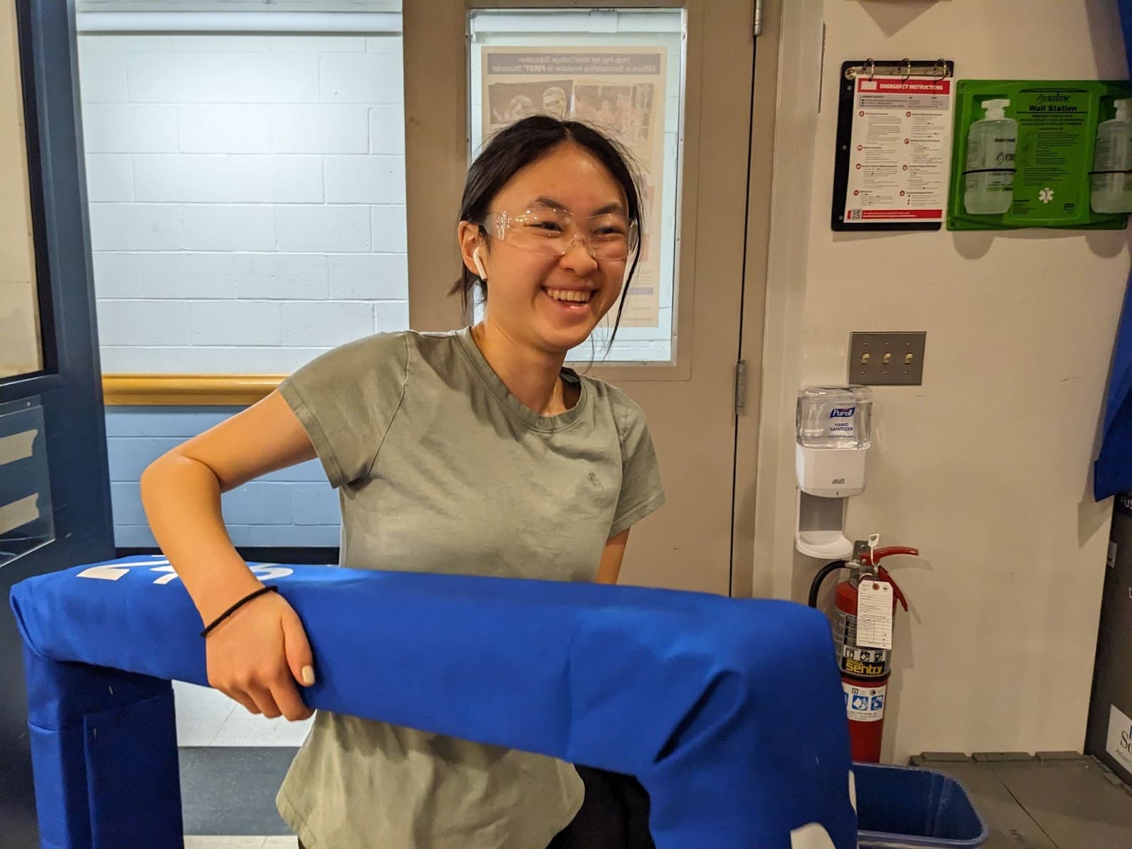 Sharon Xiong ‘27 happily holding up our newly made blue bumpers! Now it’s time to make the red ones!