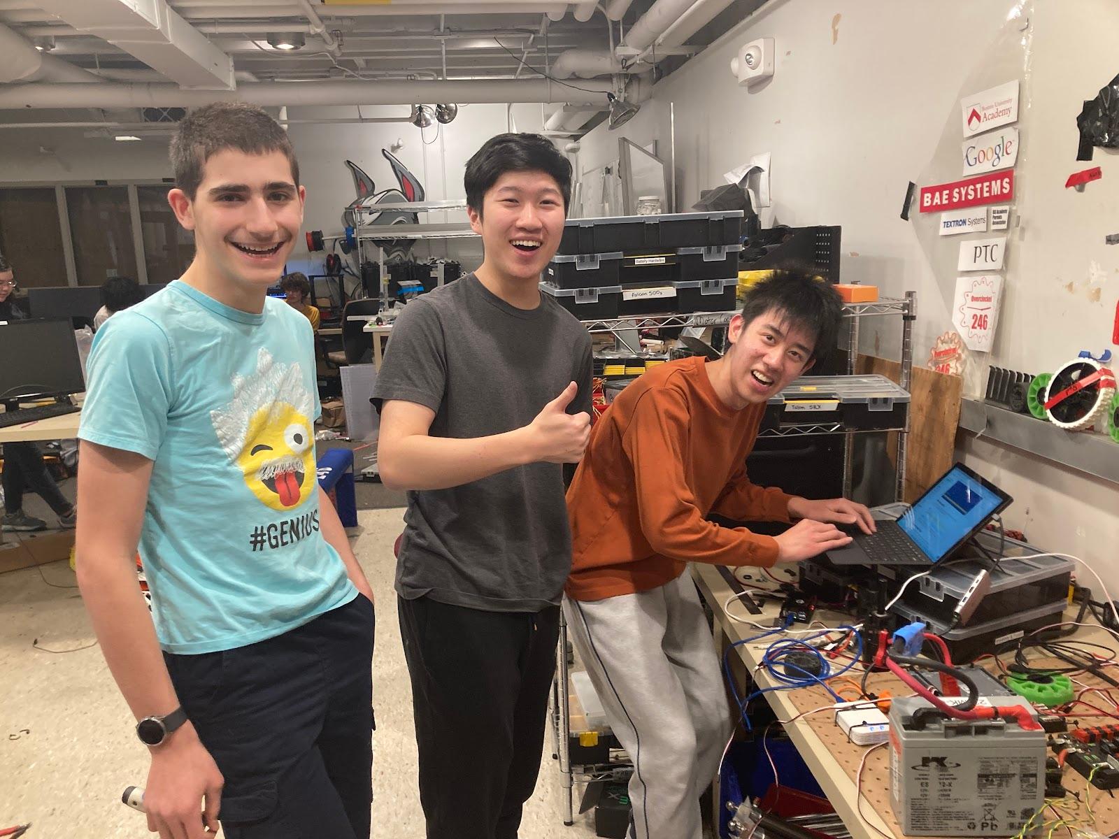 Daniel David ‘27, Nathan Wu ‘25, and Maxwell Yu ‘25 working together at our electrical test bench.