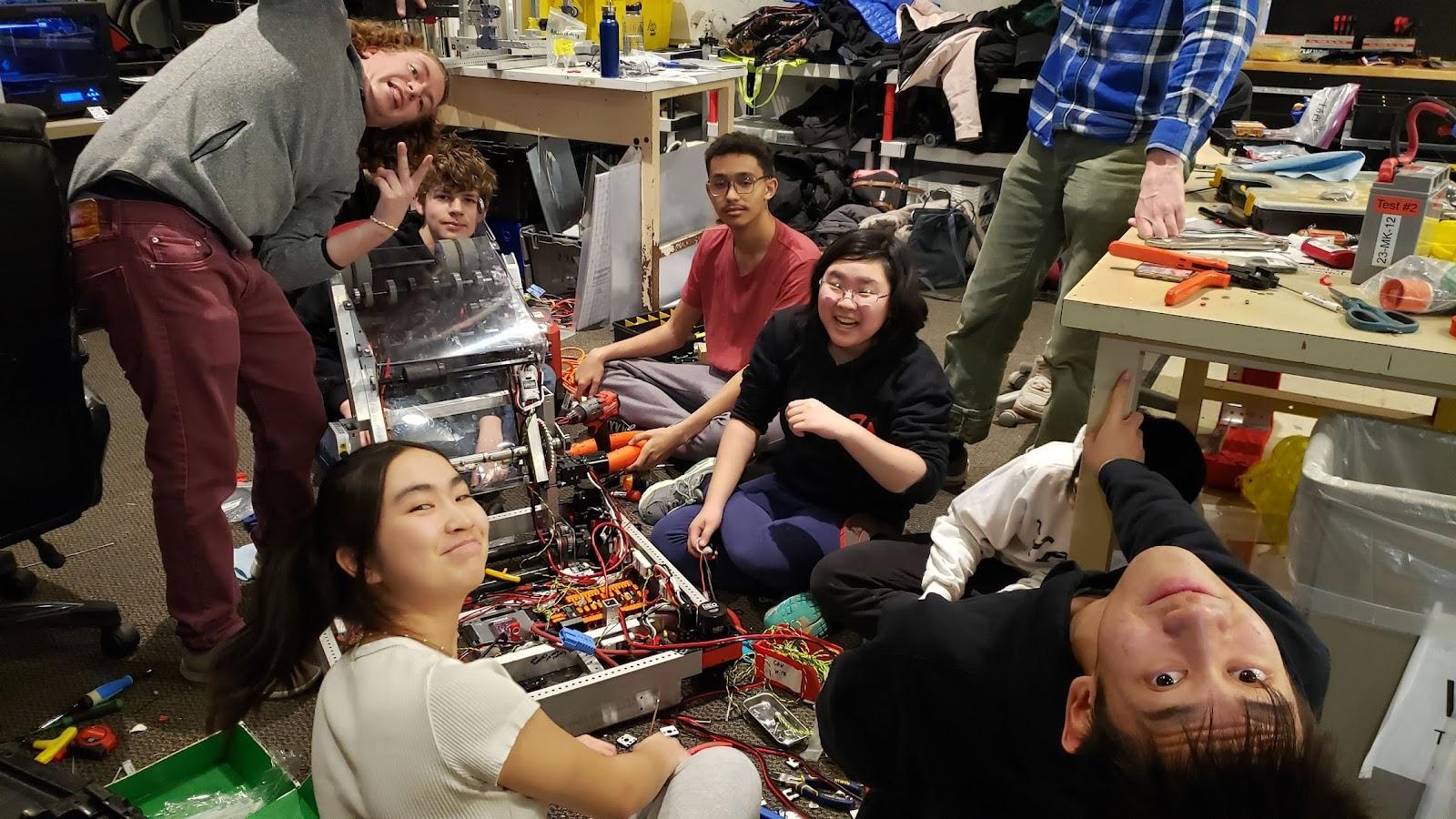 Tynan (Mentor), Coco Shen ‘27, Nate Magoun ‘27, Yaseen Lotfi ‘25 (Match High School), Kendree Chen ‘25, and Maxwell Yu ‘25 working together to finish the electrical wiring on our robot.