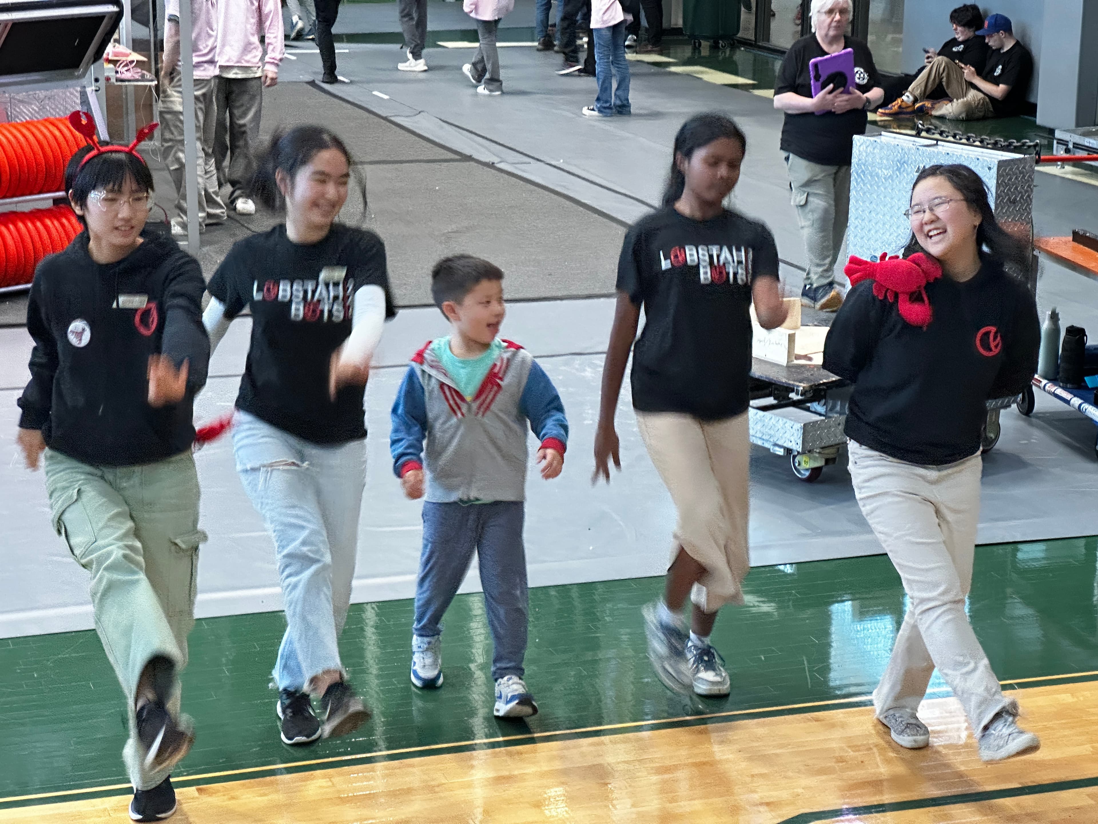 Students dance the Cupid Shuffle during a match break