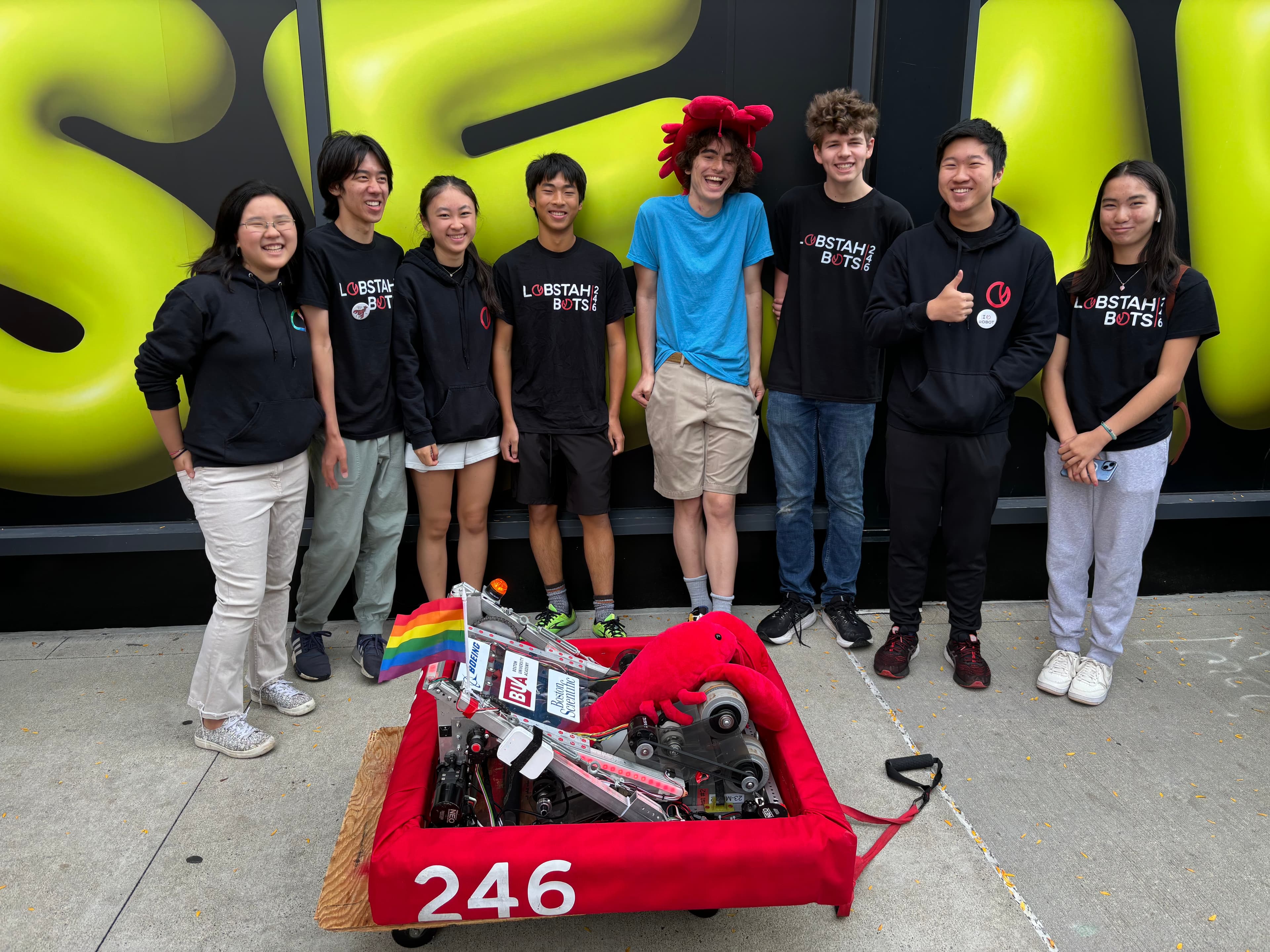 The team poses for a photo with the robot before the robot parade