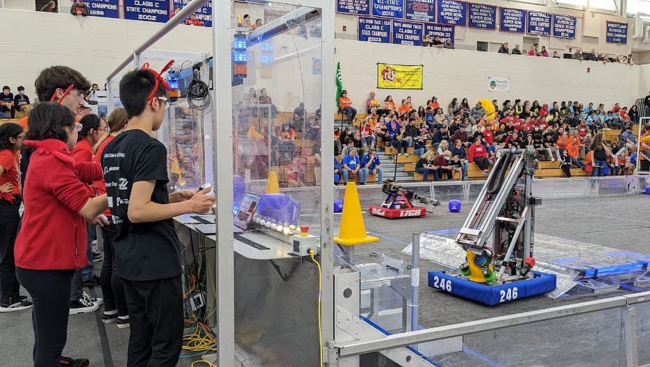 A cycle of our drive team at N.E.R.D. with Owen '25 (Driver), Maxwell '25 (Operator), and Kendree '25 (Drive Coach) working together during a match to place a cone.